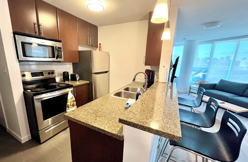 Crosstown Apartment | 2BR+Sofabed, 2-Bath, Private 500sqft sundeck, EV Parking w/Pool, Sauna, Hot Tub