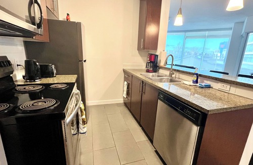 Crosstown Apartment | 2BR+Sofabed, 2-Bath, Private 500sqft sundeck, EV Parking w/Pool, Sauna, Hot Tub
