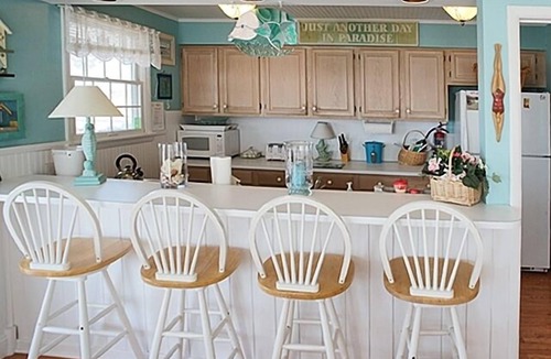 Avalon Condo | 2ND FROM THE BEACH! This property offers expansive ocean views down the coastline