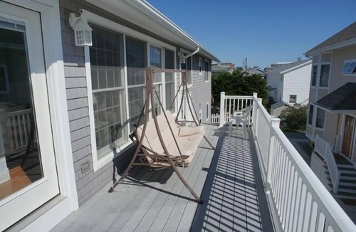 Avalon Condo | 2ND FROM THE BEACH! This property offers expansive ocean views down the coastline