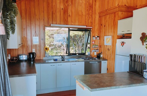 Karekare House | 3 Bed Tranquil Nature Escape with Stunning views, Spa, Beaches & Stargazing.