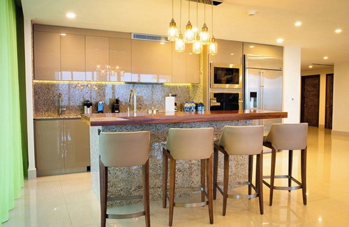 Playa Mujeres House | 3 Bedroom Ocean View with furnished balcony and hot tub along with hammocks.
