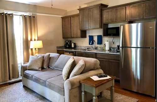 Historic Downtown District Apartment | 3 bedrooms include a king and two queen size beds, 2 bathrooms, and kitchenette.