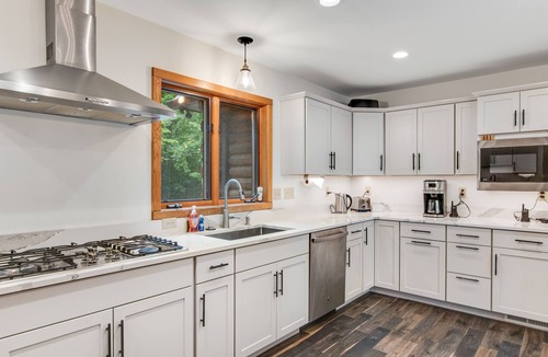 Lac du Flambeau House | 3-story chalet with private hot tub, game room & waters toys - dog-friendly