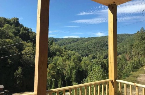Lejunior Cabin | 4BR 2 bath house with full kitchen, living room, hot tub and game room.