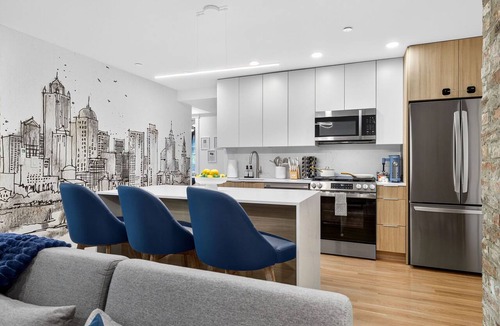 Mid-Cambridge Apartment | 4BR 3BA Designer Gem Sleeps to 12 Min to Redline T & Boston Free Parking