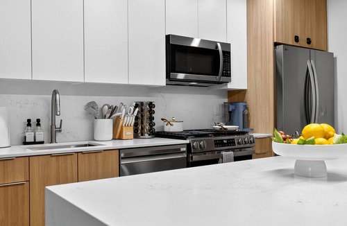 Mid-Cambridge Apartment | 4BR 3BA Designer Gem Sleeps to 12 Min to Redline T & Boston Free Parking