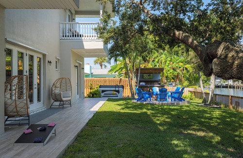 Convair Cove House | 4BR Waterfront Retreat - Private Dock, Kayaks, Hot Tub & Tiki Bar Walk to Beach
