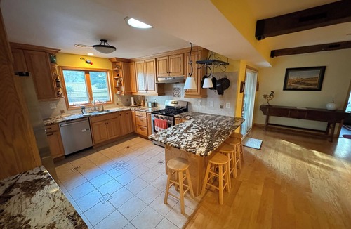 Fairfax House | 5 BR home and tree house. Screened porch & deck with hot tub and gas fire bowl.