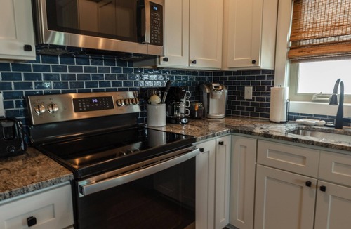 Sunset Beach House | 5 Star Sunset Beach canal home - Kayak, paddleboard, bring your boat & jetskis