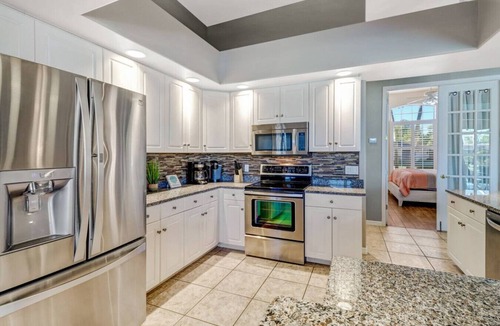 Caloosahatchee House | 5BR/3BA Waterfront Oasis in Cape Coral | Heated Pool & Spa + Private Dock | Gulf Access