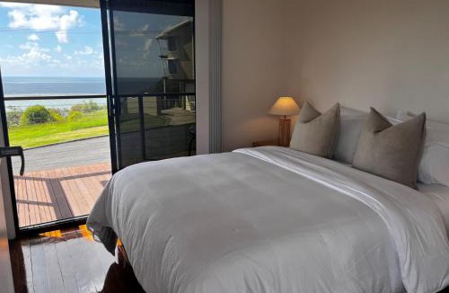 Rainbow Beach House | 76 Cooloola Drive - Rainbow Beach. Aircon. Wifi. Ocean views