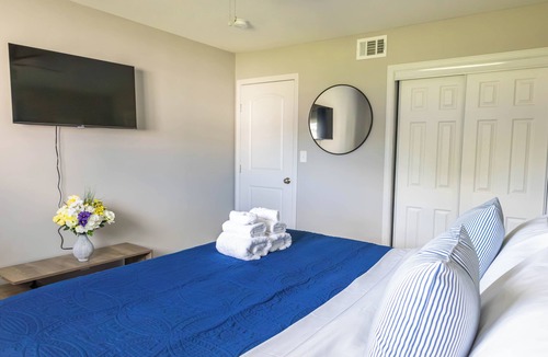 Shawnee Apartment | A charming bedroom with a king bed in quiet Shawnee neighborhood near highways.