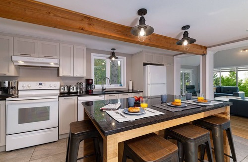 Baie-St-Paul House | A charming little waterfall to go with the spa