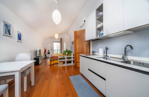 Udine House | A comfortable and bright 40 sq m studio apartment, perfect for two people, located on the first floor of a small villa (no elevator).The property is located in an extremely quiet area surrounded by greenery, with a cycle path nearby. Guests can easily re