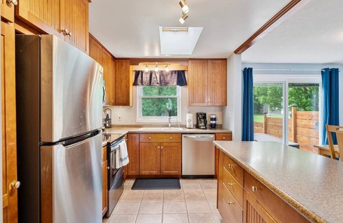 Romulus House | A dreamy Seneca Lake retreat with sweeping views, a relaxing hot tub under the stars, flexible bedroom setups, a fully stocked kitchen, cozy living spaces, and easy access to the lake, wineries, and waterfalls.