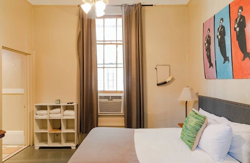 Treme Apartment | A funky-chic one-bedroom apartment with a private entrance and a full kitchen.