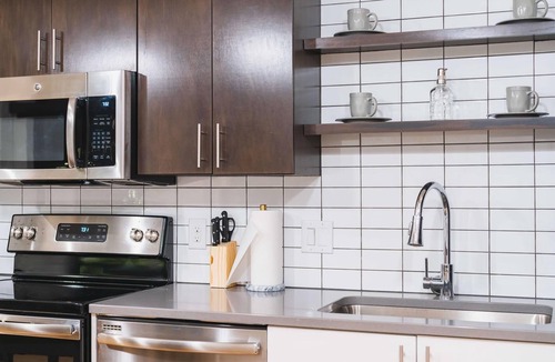 Downtown Omaha Apartment | A historic beautifully detailed suite, 1,300 square foot, corner loft in the heart of the Old Market