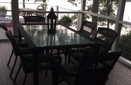 Edgewater House | A huge deck and screen porch on this contemporary cape in Edgewater offers great views of Beard's Creek and out onto the South River.
