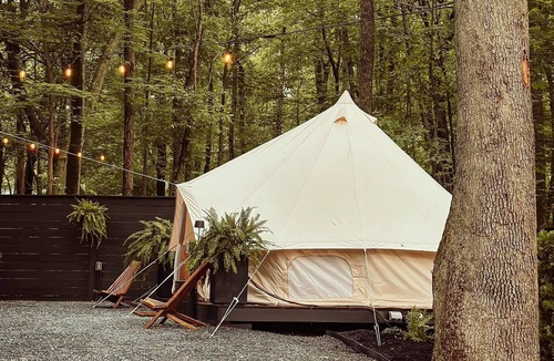 Denver House | A luxurious glamping tent nestled in the trees.