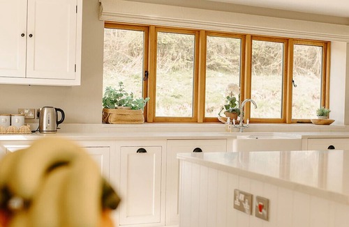 Acrefair House | A luxurious riverside cottage with stunning views, a hot tub, and fishing access.