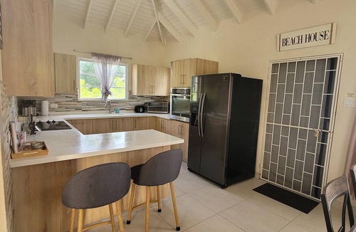 Holder's Hill House | A modern and spacious house, steps to the beach with a private pool!