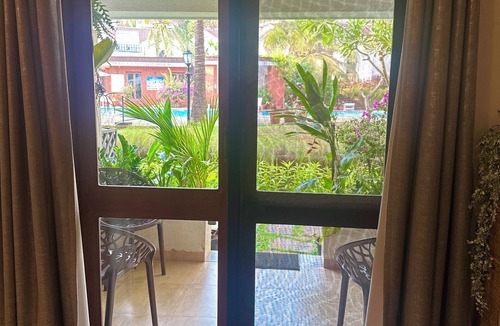 Arpora Apartment | A spacious 2BHK poolside apartment nestled in the foothills - 8min from beach.