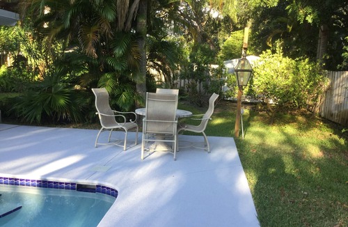 Central Beach House | A tropical retro bungalow secluded area with terrazzo flooring & heated pool.