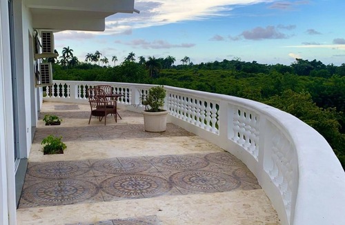 Cabrera Hotel | Adorable tropical room with a stunning balcony, pool, fire pit, gardens, & more!