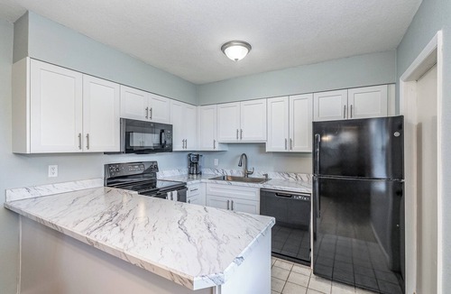 Port Canaveral Condo | Affordable 2BR Main floor unit RIGHT ON THE BEACH! 1 King & 2 Queen Beds.