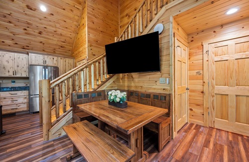 Union Hall Cabin | All Decked Out at Pine Haven — a brand-new lakefront log home on Smith Mountain Lake with a private hot tub, 50+ ft of wraparound deck, fire pit patio & easy lake access. Two full kitchens. One of 5 cabins on an 8-acre lakefront micro-resort.
