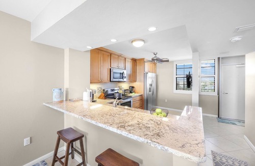 Marco Island Condo | Alluring Beachfront Condo | Pool & View of Lagoon