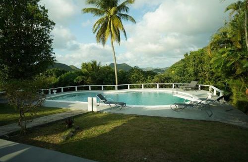 Choc House | Almarlene House, spacious home sea view, large pool, patios, cot, cook