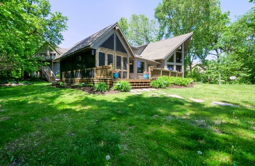 Alexandria Cabin | Amazing lake home on level lot with loft above garage paddle boat