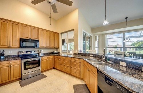 Fort Myers Villa | Ample 3 BR/3 bath waterfront Villa with 2 suites, heated pool, kayaks, pool table, fishing poles