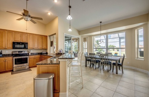 Fort Myers Villa | Ample 3 BR/3 bath waterfront Villa with 2 suites, heated pool, kayaks, pool table, fishing poles