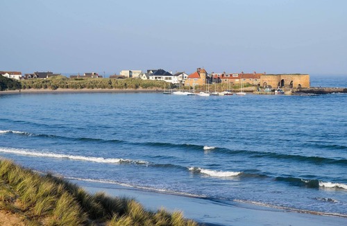 Ruddington Cottage | An open plan first floor apartment in the seaside resort of Beadnell.