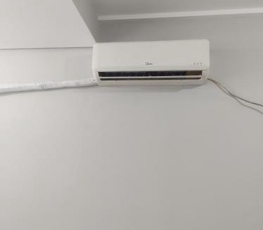 Alexandra Apartment | Ap 2 quartos amplos, com Ar condicionado central, Internet, Netflix e Garagem privativa