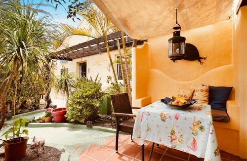 Teguise Apartment | Apartment 1 with panoramic window in the bedroom facing the sea and Risco Famara