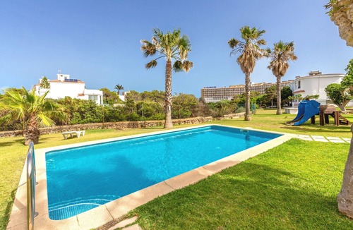 Cala en Forcat Apartment | Apartment 'De Playa En Ciutadella' with Shared Pool, Shared Garden and Wi-Fi