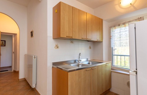 Rosignano Marittimo Apartment | Apartment 'Malva' with Shared Pool and Garden