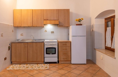 Rosignano Marittimo Apartment | Apartment 'Menta' with Shared Pool and Garden