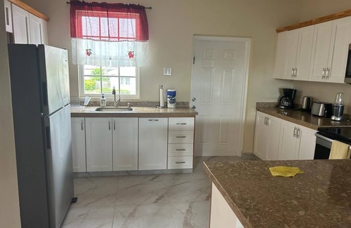 Enterprise House | Apt #1-Newly built apartments, great for families/friends, minutes walk to beach