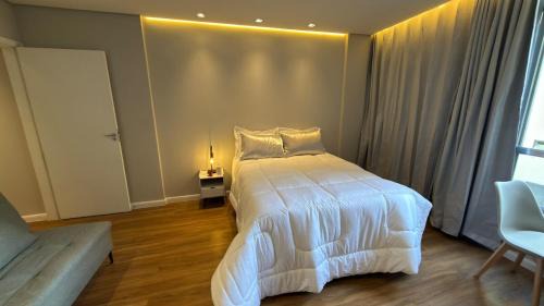 Aparecida Apartment | Apto 711 - Elegância com vista parcial da Praia