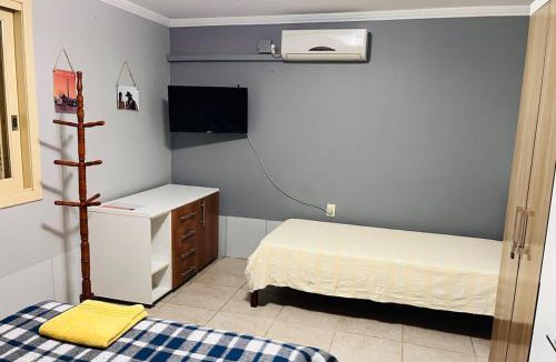 Nonoai House | Apzito Tri com garagem