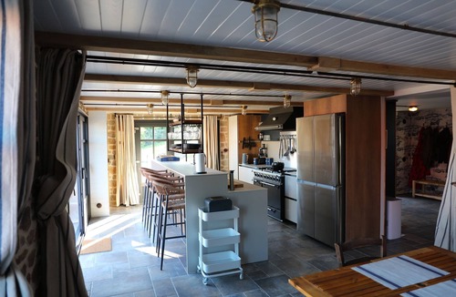 Esquibien House | Architect-designed stone house with heated pool, just ten steps from the beach