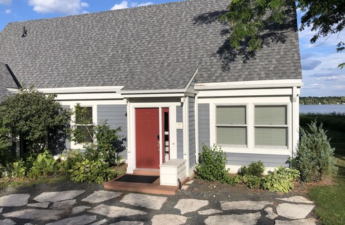 Isanti House | Architectural lake home with a monthly discount