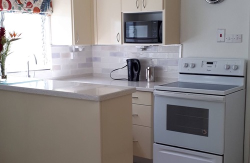 Lascelles Apartment | Art Studio 2 is set in lovely gardens,35 yards from the beach