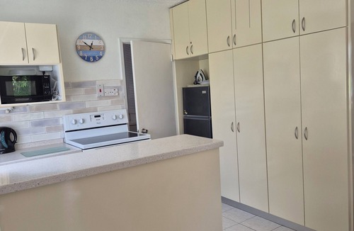 Lascelles Apartment | Art Studio 2 is set in lovely gardens,35 yards from the beach