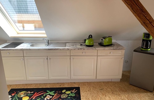 Wendisch Waren Apartment | Attic apartment Muttis Stübchen - two-room vacation apartment with eat-in kitchen